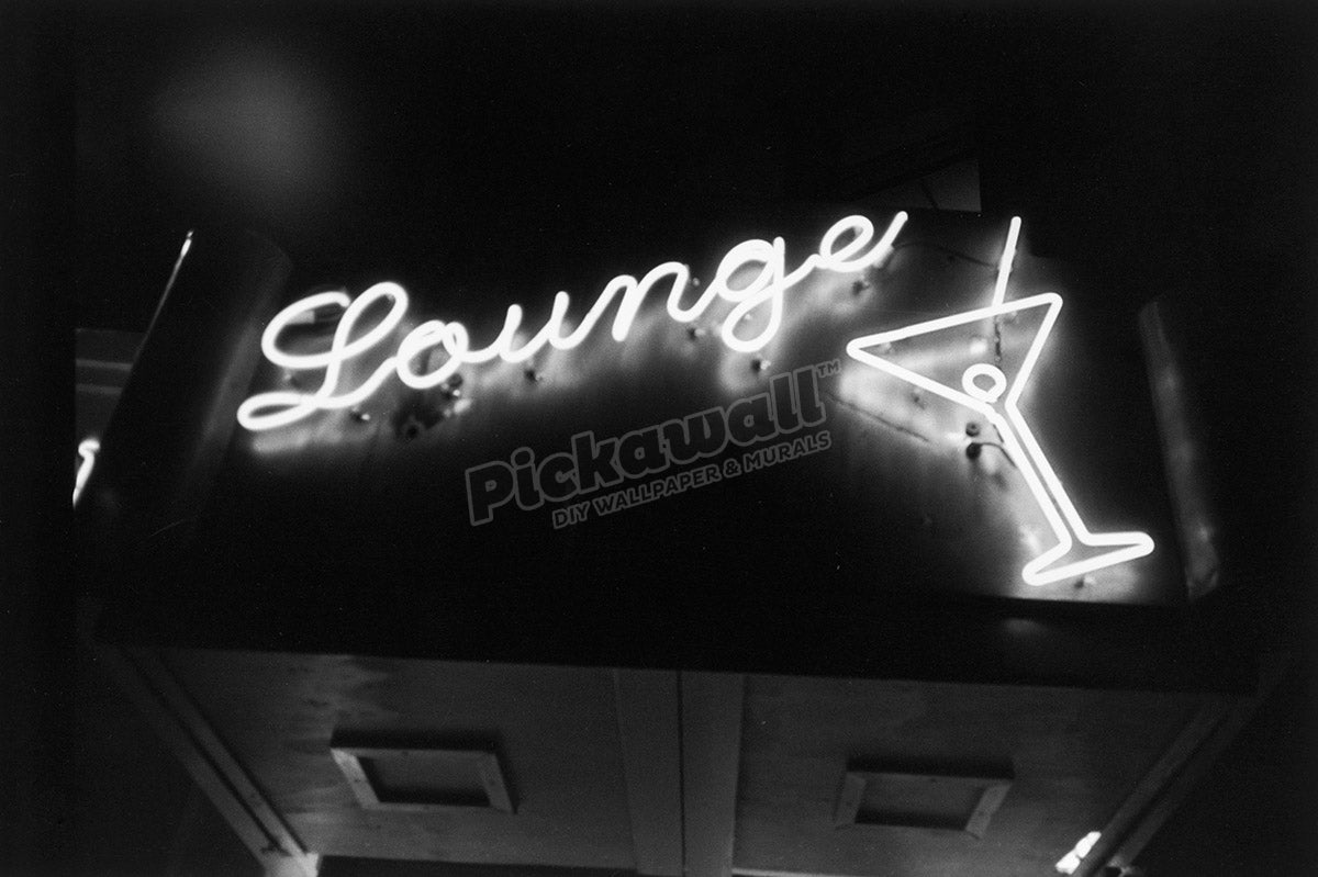 Neon lounge sign with martini glass at night