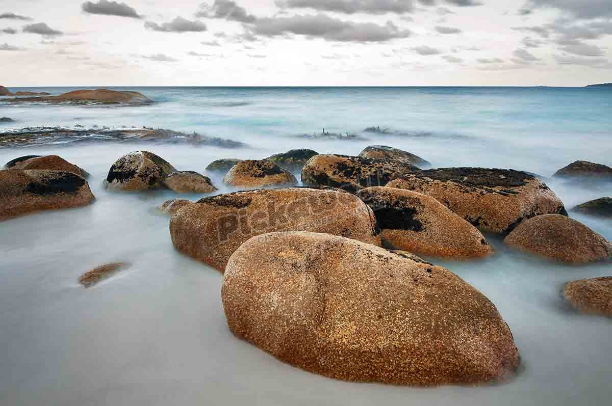 Smooth boulder at the beach of Cosy Corner in the Bay of Fires.