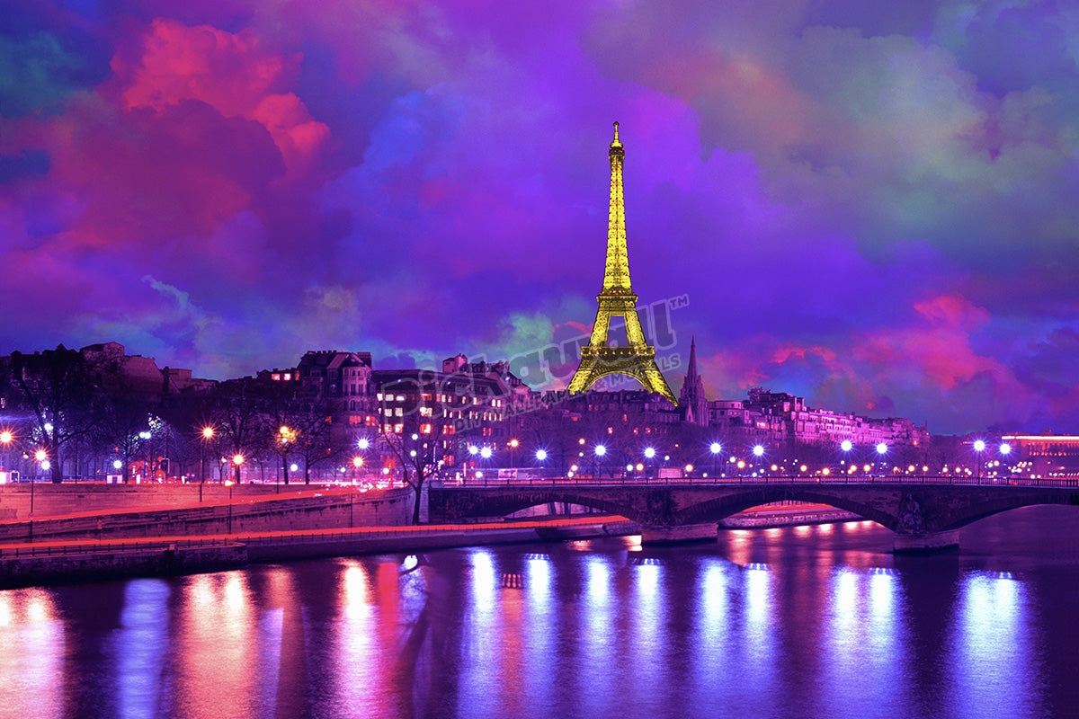 Eiffel Tower at night against a dramatic sky'