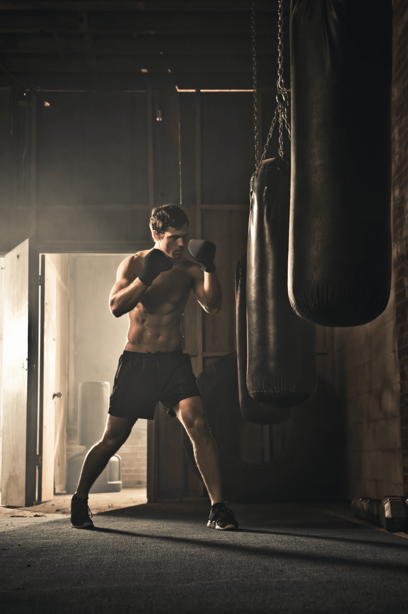 boxer hitting punching bag - Pickawall