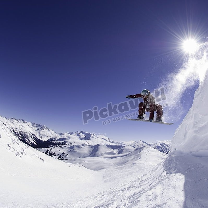 Female snowboarder jumping off cornice, low angle view - Pickawall