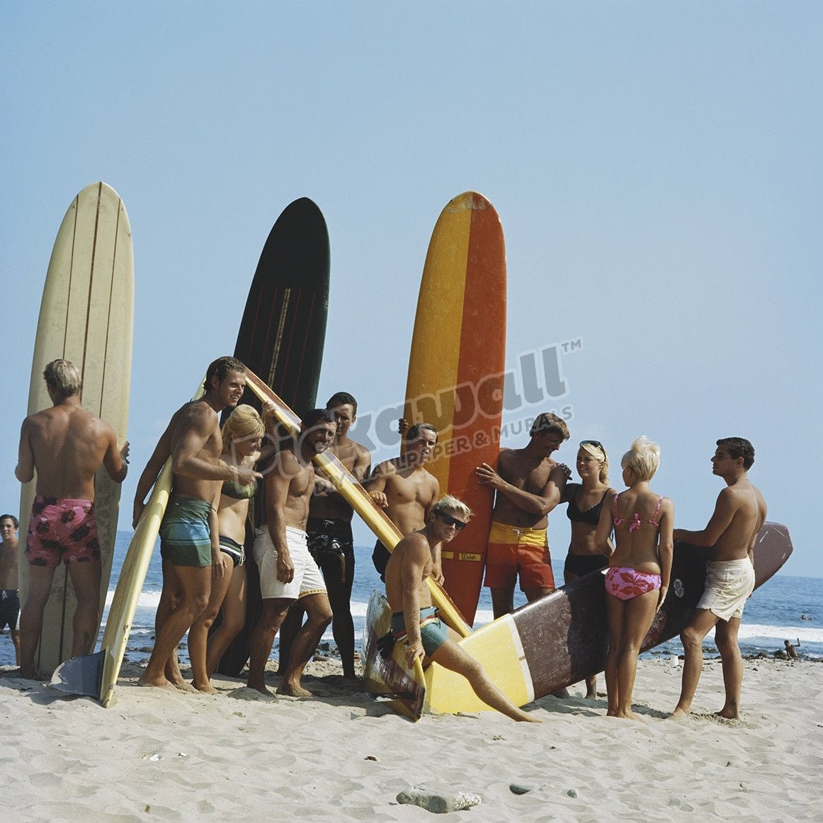 People on beach with surf board - Pickawall