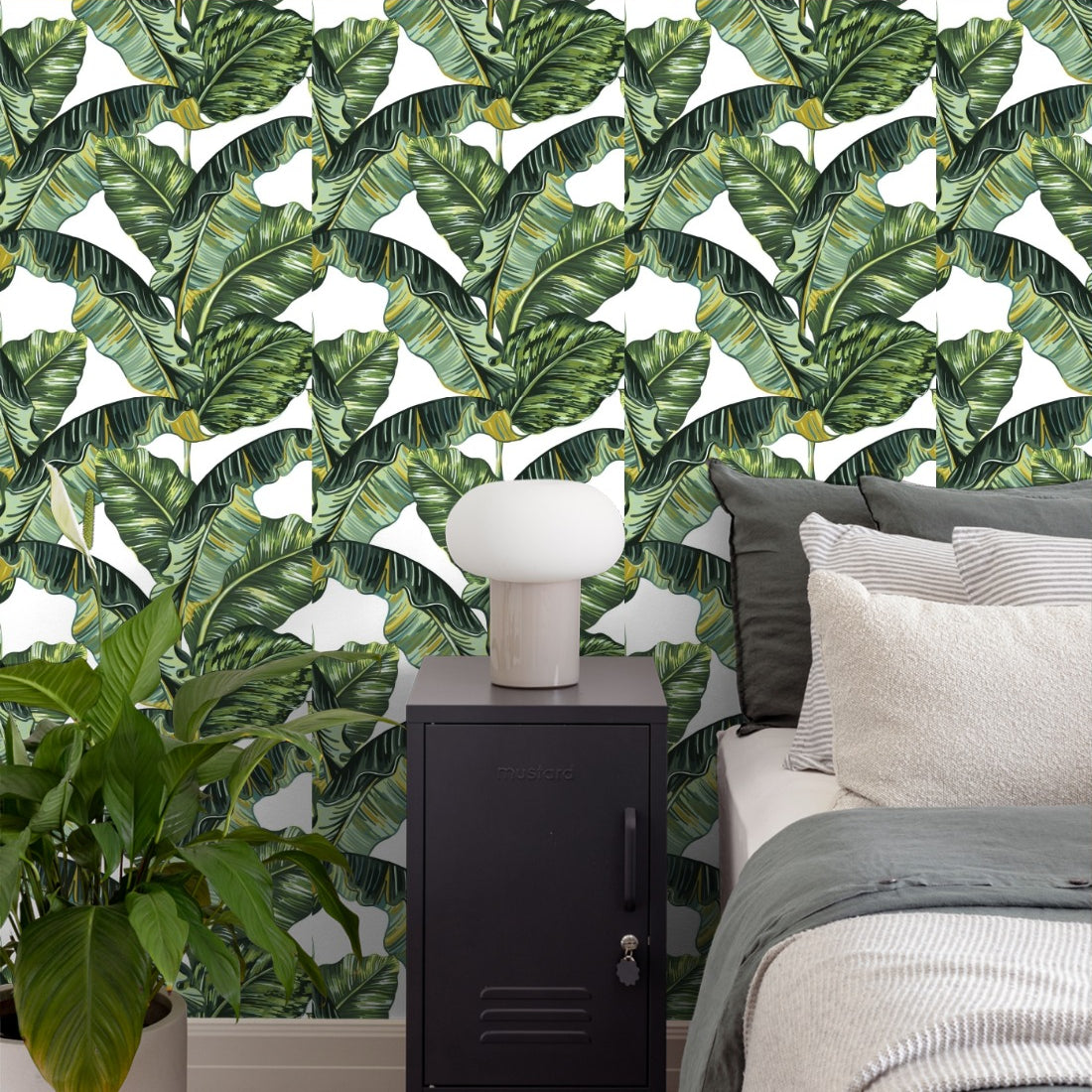Tropical jungle palm leaves pattern wallpaper in a bedroom - Pickawall