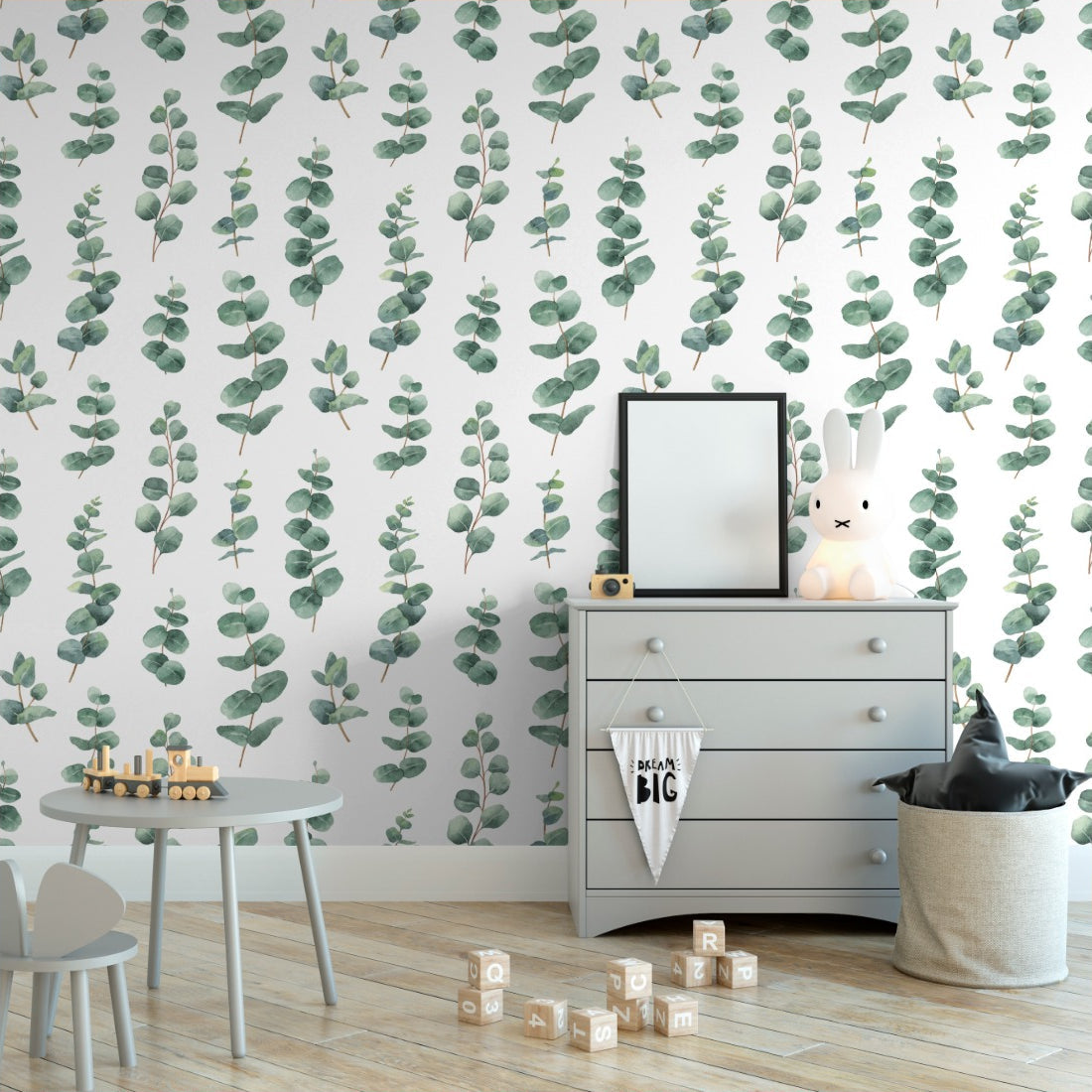 Watercolour silver dollar eucalyptus leaves wallpaper in a nursery - Pickawall