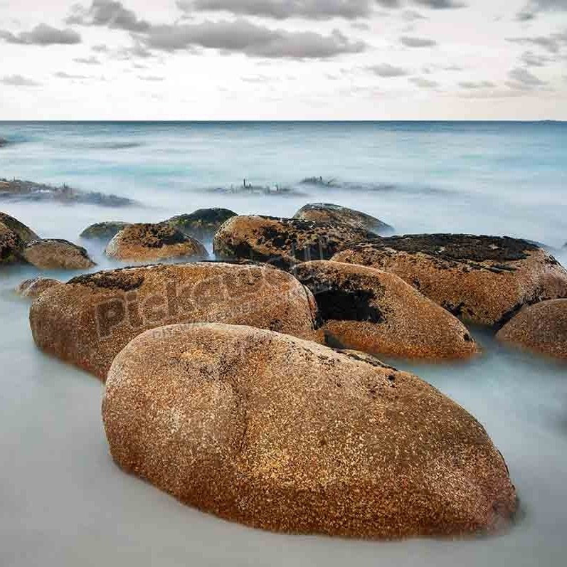 Smooth boulder at the beach of Cosy Corner in the Bay of Fires. - Pickawall