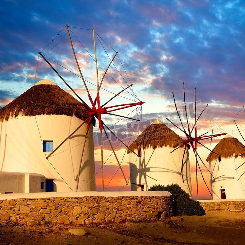 Sunset over the traditional Greek windmills of Mykonos Chora. Cyclades Islands, Greece - Pickawall