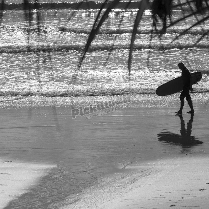 Surfer walking a beach - Pickawall