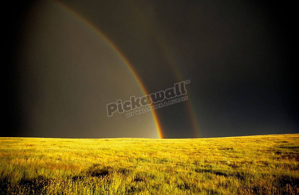 rainbow trailing a prairie thunderstorm