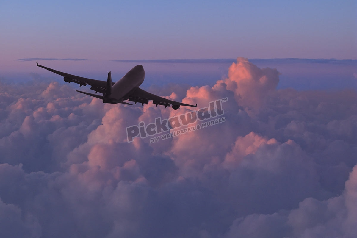 Jet (Boeing 747) Flying over Clouds at Sunset