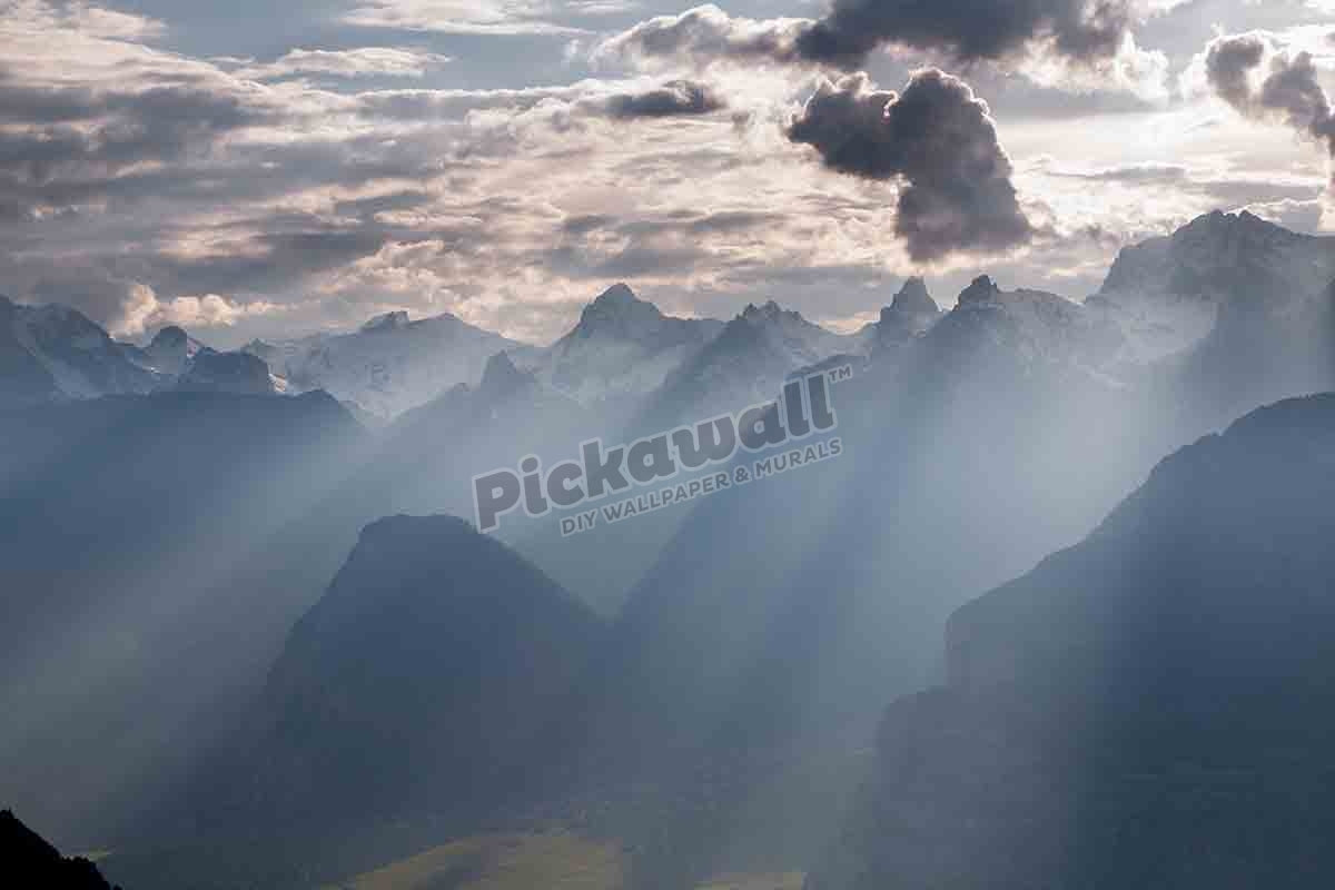 SHAFTS OF LIGHT IN MOUNTAINS, SWITZERLAND
