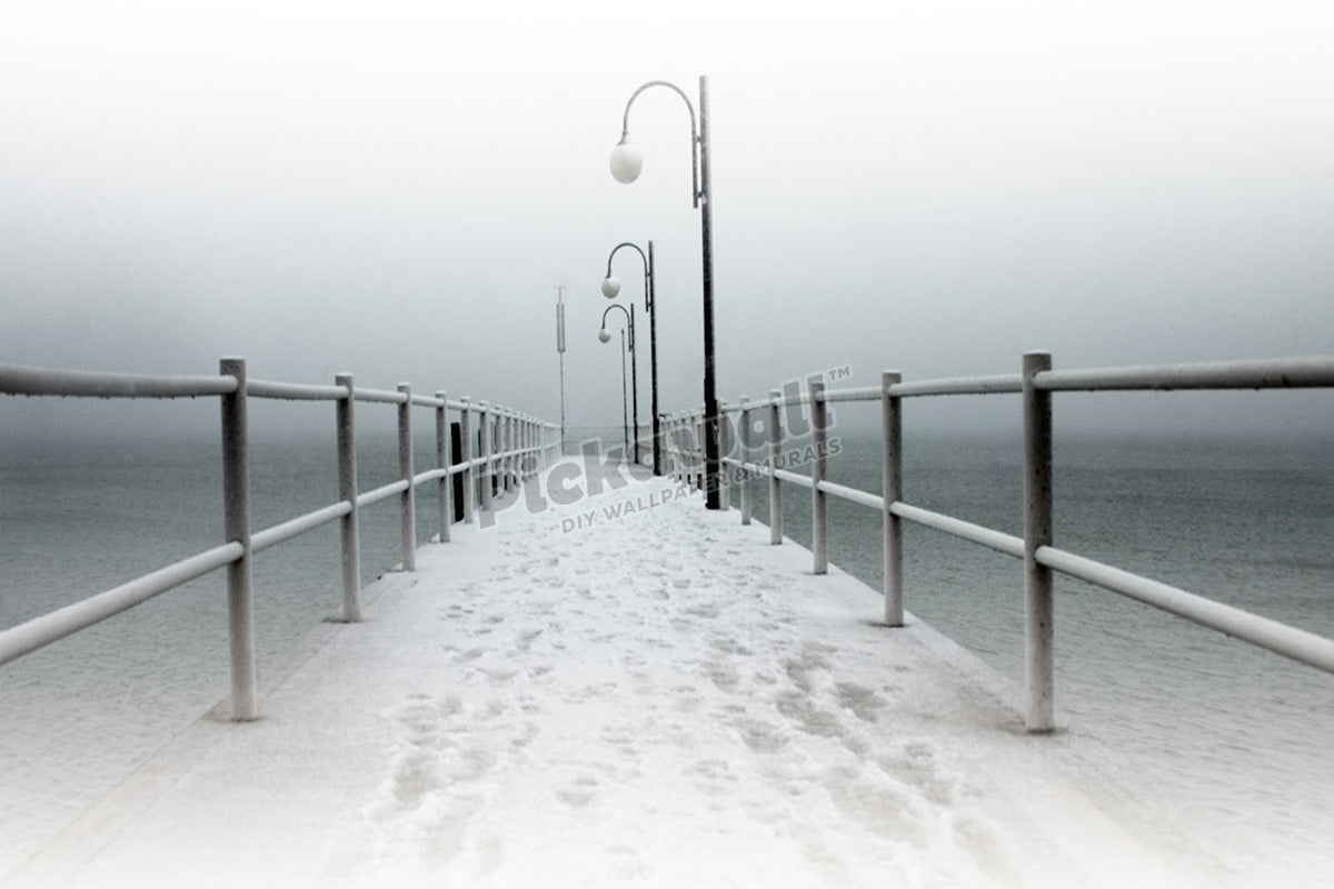 Foot prints in snow on jetty