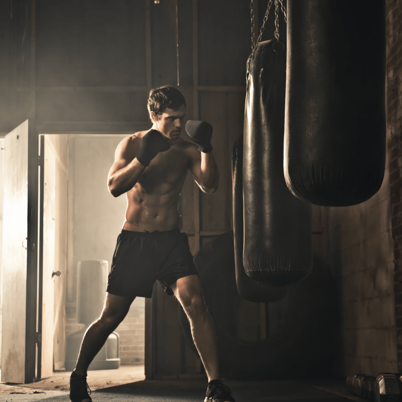 boxer hitting punching bag - Pickawall