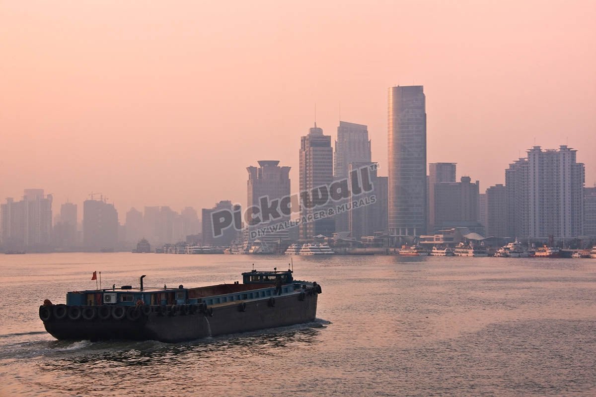 Buildings along Huangpu River and barge at sunrise, Shanghai, China - Pickawall