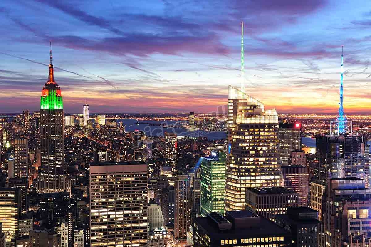 New York City skyline with urban skyscrapers at sunset.