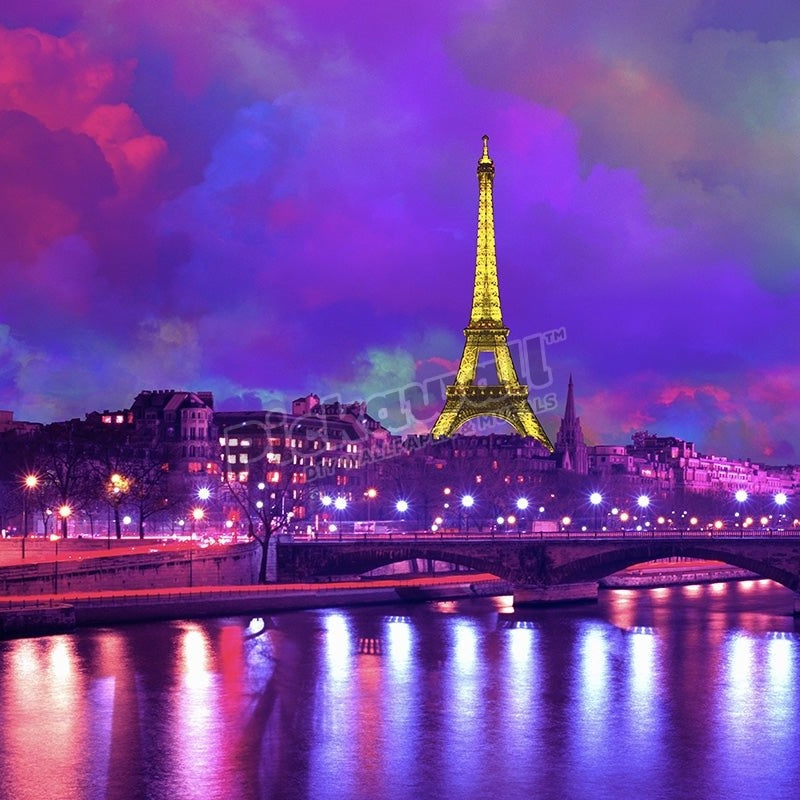 Eiffel Tower at night against a dramatic sky' - Pickawall