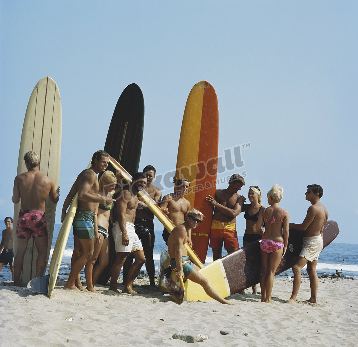 People on beach with surf board