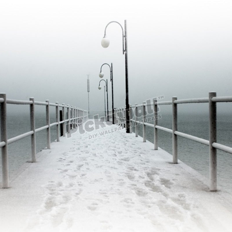 Foot prints in snow on jetty - Pickawall