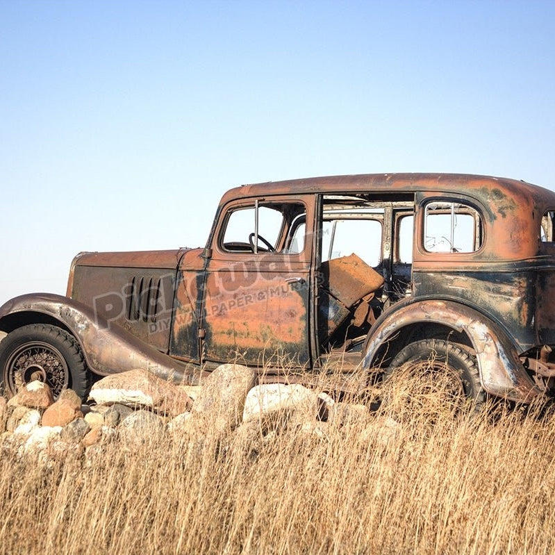 Grandpas old car sits atop a pile of rocks - Pickawall