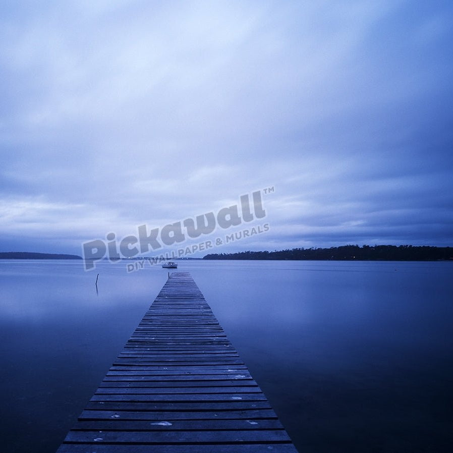 Jetty with still water and clouds. - Pickawall