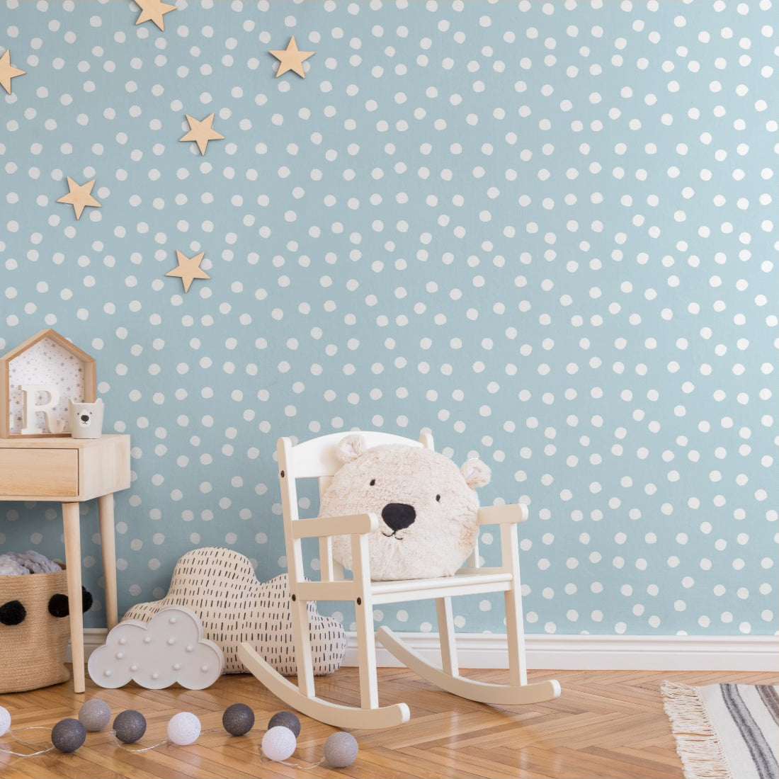 White spots on a blue background wallpaper in a nursery - Pickawall