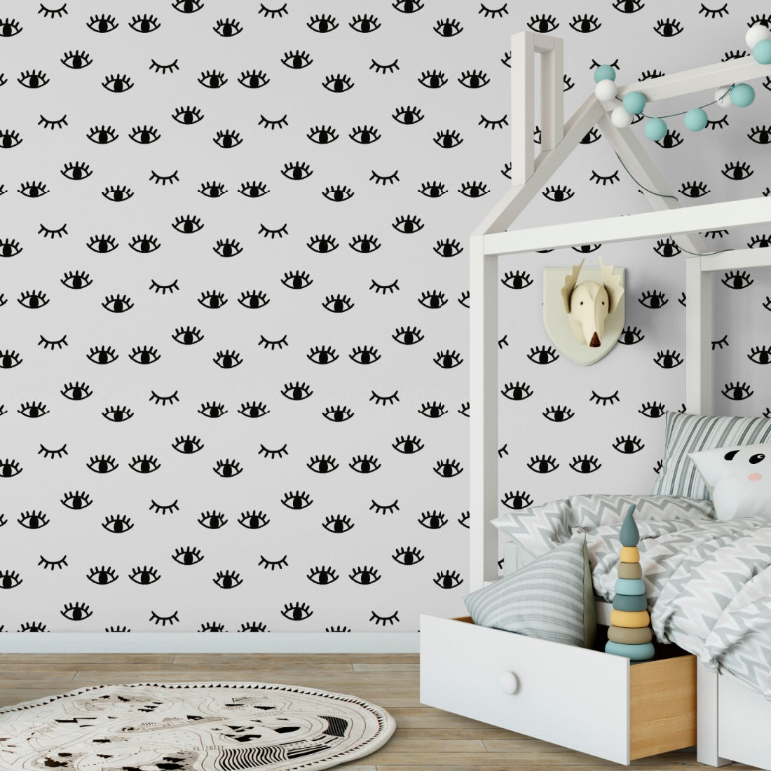 open and winking eyes pattern wallpaper in a kids bedroom - Pickawall