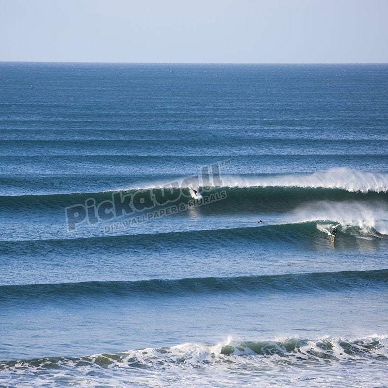 Surfer taking off on perfect wave - Pickawall